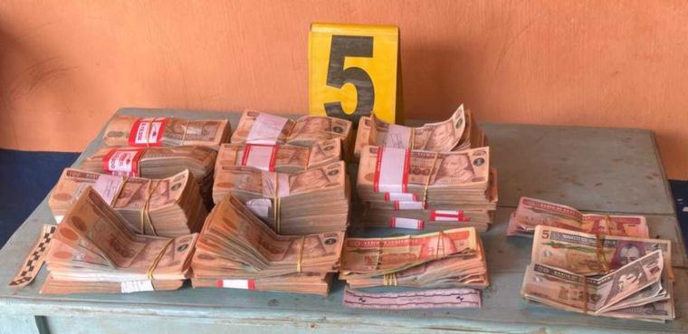Una mujer, Q835 mil, un revólver y municiones: lo que hallaron en allanamiento en Huehuetenango